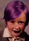 [me at 8 years old, with purple hair and black lipstick]
