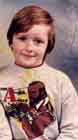 [me aged 9, with the first in a long line of butch men on my chest (it's an A-Team top, with a picture of Mr. T)]